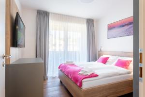 Posteľ alebo postele v izbe v ubytovaní Apartmány Resort Vrchlabí