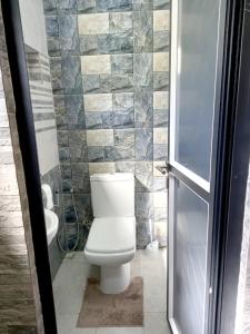 a bathroom with a toilet and a sink at Idyllic Villa in Pereybere with Private Pool in Pereybere
