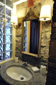 a bathroom with a sink and a mirror at Podere Pontepietra in Soriano nel Cimino