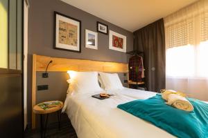 Postel nebo postele na pokoji v ubytování Berti Hotel - Mulhouse Centre Gare
