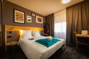 Postel nebo postele na pokoji v ubytování Berti Hotel - Mulhouse Centre Gare