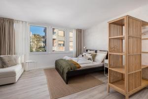 a bedroom with a bed and a book shelf at Molo Longo - Central Apartments & Rooms in Rijeka