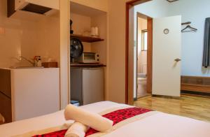 Postel nebo postele na pokoji v ubytování Panketo Lodge & Yoga Studio