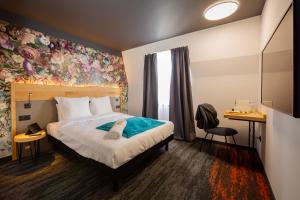 Postel nebo postele na pokoji v ubytování Berti Hotel - Mulhouse Centre Gare