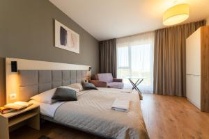 Posteľ alebo postele v izbe v ubytovaní Wolska Residence I