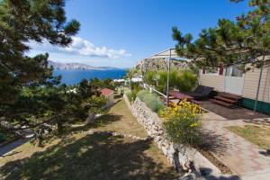a house with a view of the water at Camping Bunculuka in Baška