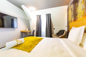 Postel nebo postele na pokoji v ubytování Berti Hotel - Mulhouse Centre Gare
