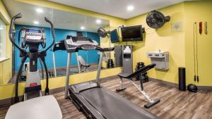 a fitness room with a treadmill and a tv at Best Western Sandy Inn in Sandy