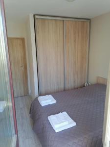 מיטה או מיטות בחדר ב-Borovets Gardens Apartment A27