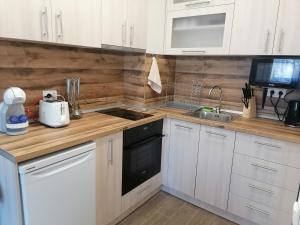 A kitchen or kitchenette at Borovets Gardens Apartment A27