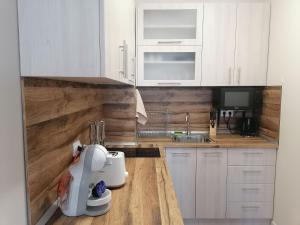 A kitchen or kitchenette at Borovets Gardens Apartment A27