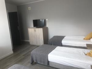 Posteľ alebo postele v izbe v ubytovaní Pokoje blisko SUNTAGO
