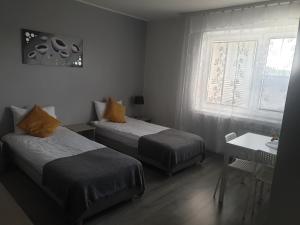 Posteľ alebo postele v izbe v ubytovaní Pokoje blisko SUNTAGO