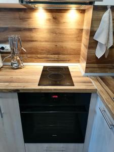 A kitchen or kitchenette at Borovets Gardens Apartment A27