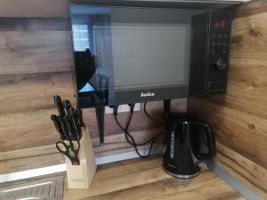 A television and/or entertainment centre at Borovets Gardens Apartment A27