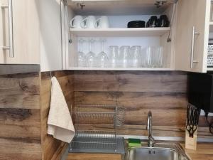 A kitchen or kitchenette at Borovets Gardens Apartment A27