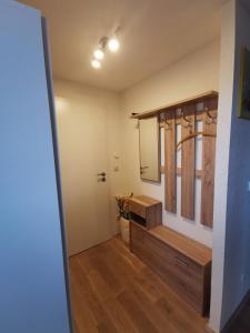 a bathroom with a sink and a mirror at Ferienwohnung und Pension Gürtler in Werdau