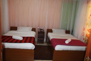 Postelja oz. postelje v sobi nastanitve Hotel Kepler