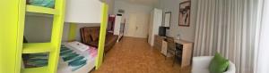a small room with a bedroom with a bunk bed at Pensión Pamplonabeds in Pamplona