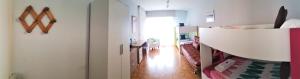 a room with a hallway with a white wall at Pensión Pamplonabeds in Pamplona