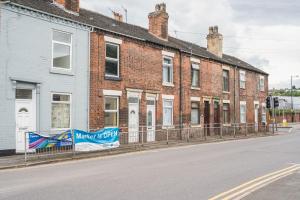 a row of brick houses on a city street at Hanley Park House in Stoke on Trent
