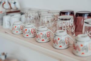 a shelf filled with glass jars on a shelf at B&B ARENA in Pompei