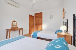 Ein Bett oder Betten in einem Zimmer der Unterkunft Villa Casa Angel