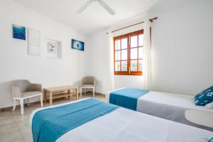 Ein Bett oder Betten in einem Zimmer der Unterkunft Villa Casa Angel