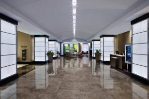 an empty lobby with a large hall with windows at The Westin Annapolis in Annapolis