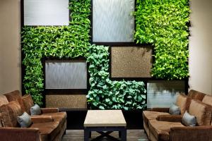 a living room filled with lots of green plants at The Westin Annapolis in Annapolis