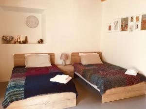 Postel nebo postele na pokoji v ubytování B&B La Corte del Segrino
