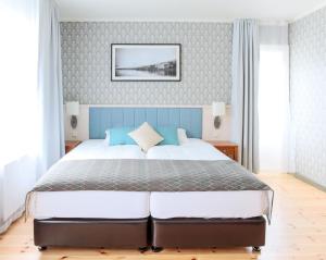 Llit o llits en una habitació de Fosshotel Eastfjords