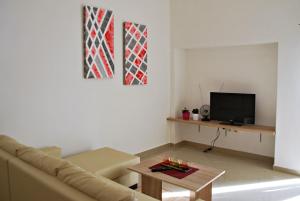 a living room with a couch and a table at Apartment Mateo in Šajini