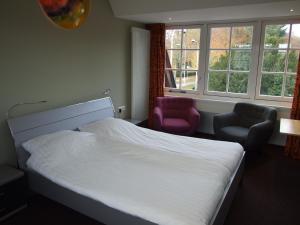 Ένα ή περισσότερα κρεβάτια σε δωμάτιο στο Meneer Pos