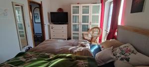 Ένα ή περισσότερα κρεβάτια σε δωμάτιο στο Alpennest +1 φωτογραφίες