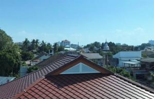 a view of the roofs of a city at Nanta Glam CM Hotel & Residences in Chiang Mai