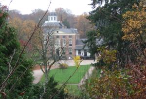 a large brick building with a tower on top of it at Meneer Pos in Velp