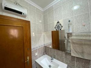 a bathroom with a sink and a mirror at Bungalow Alberca La Nucia in Polop +20 photos