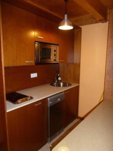 Kuchyň nebo kuchyňský kout v ubytování Acogedora Buardilla duplex 6 pax