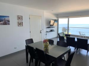 Duplex 1 Fila Vista Bahía Paracas - Sotavento 501 T3的电视和/或娱乐中心