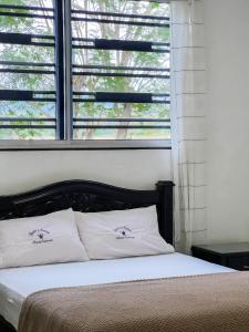 Postel nebo postele na pokoji v ubytování Hotel Acosta Castro