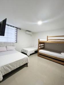 Postel nebo postele na pokoji v ubytování Hotel Acosta Castro