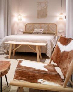 Łóżko lub łóżka w pokoju w obiekcie Casa du Soleil Hostal Boutique