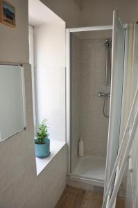 a bathroom with a shower and a bath tub at Bandol plage port in Bandol