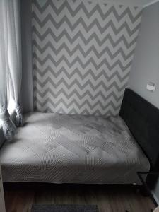 Posteľ alebo postele v izbe v ubytovaní Apartament Premium