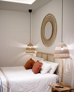Łóżko lub łóżka w pokoju w obiekcie Casa du Soleil Hostal Boutique