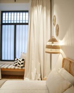 Łóżko lub łóżka w pokoju w obiekcie Casa du Soleil Hostal Boutique