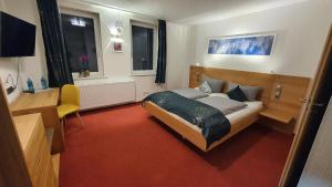 Ein Bett oder Betten in einem Zimmer der Unterkunft HOTEL BIKE & HIKE