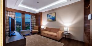 Кровать или кровати в номере Movenpick Hotel Malatya