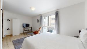Letto o letti in una camera di Nonanteneuf appart hōtel Aigle - contactless check-in